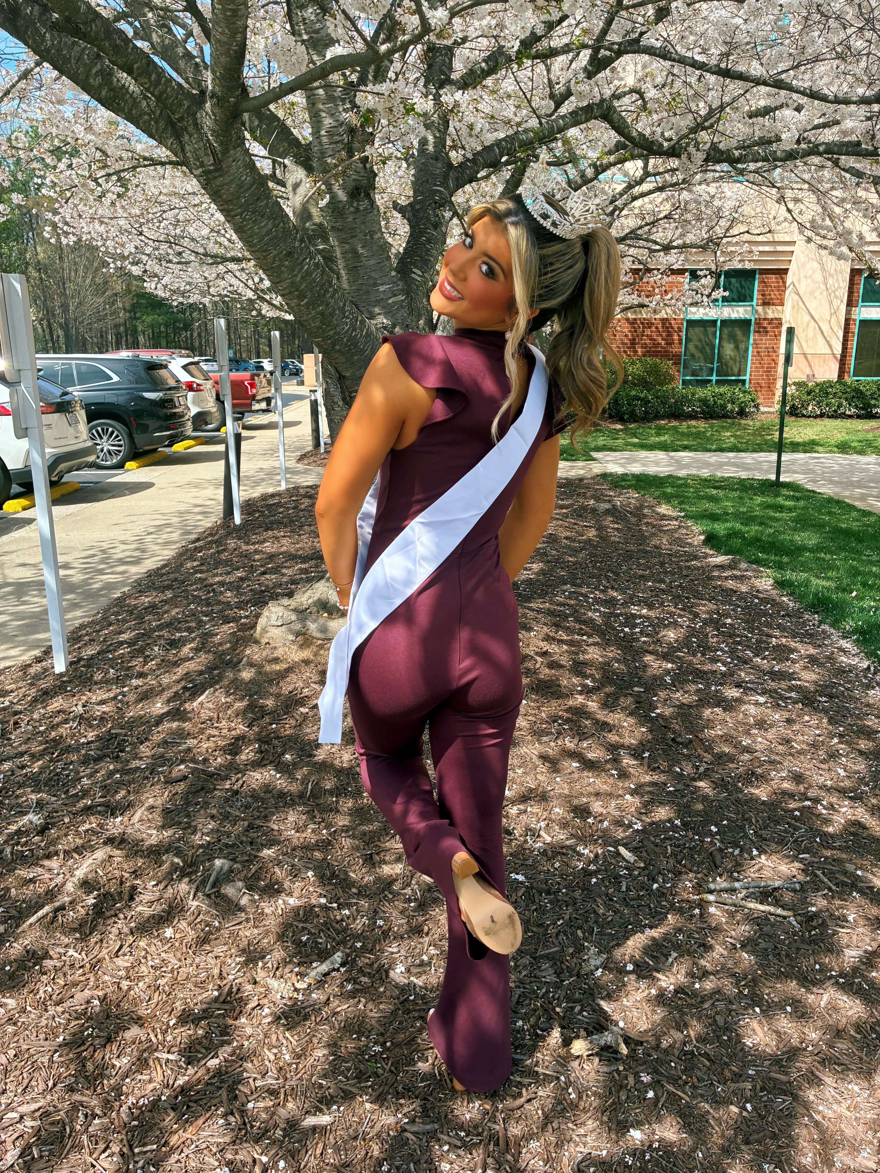 Gianna Buff in burgundy gown with sash